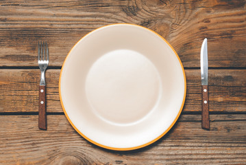 Simple table setting on wooden background