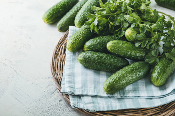 Many green cucumbers on table