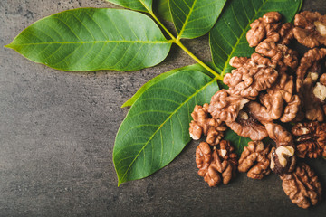 Tasty walnuts on grey background