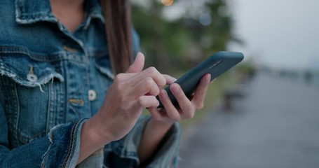 Woman use of mobile phone at outdoor