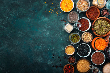 Zero waste and sustanable lifestyle. Plastic free storage and cooking concept. Various organic superfoods, beans, grains, cereals, legumes, seeds in reusable cans and jars