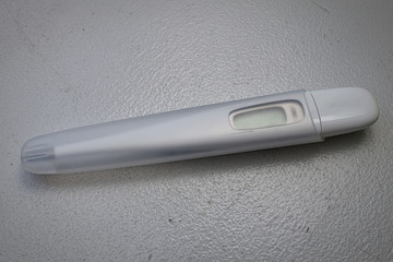 a white digital thermometer
