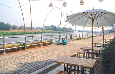 Seating table and umbrella with a waterfront atmosphere