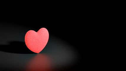 3D illustration with a sponge textured red heart in the spot light in the black background