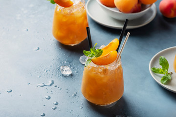 Fresh apricot cocktail with ice and mint