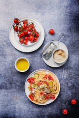 Traditional Italian pasta with tomato, zucchini and parmesan