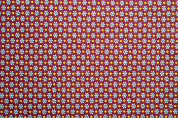 Close-up cotton lightweight fabric with a fine brown print. Background for the texture of outerwear and fashion.