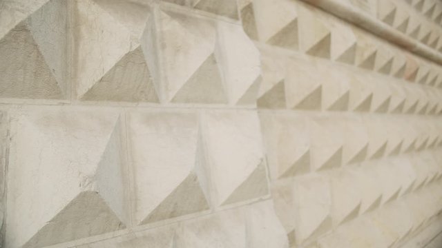 Close up pan right on Palazzo dei Diamanti in Ferrara, Italy