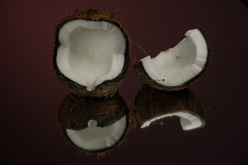 Coconut on a red background. Dark background