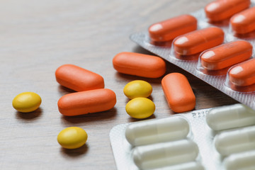 Close-up of tablet packages on the table. Concept of protection and treatment of coronavirus infection.