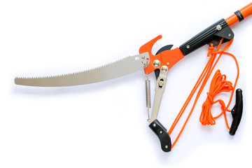 pruning saw and pruning shears isolated on white background. Scissors, pulling with rope.