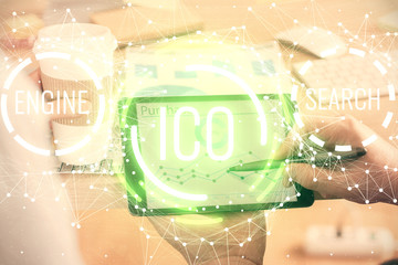 Double exposure of man's hands holding and using a phone and crypto currency blockchain theme...