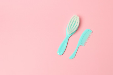 Baby care accessories on pink background flat lay