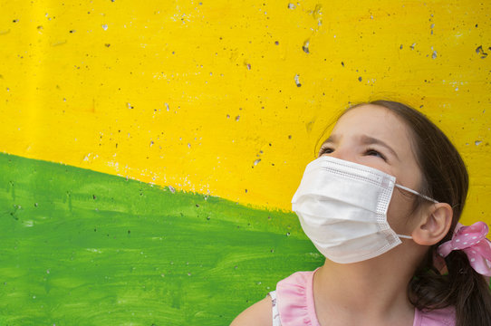 Hopeful Little Girl Wears Face Mask During Covid-19 Pandemic