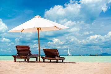 Sunbeds and umbrella at the beach