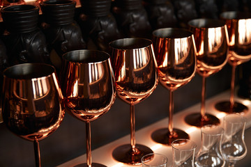 gold metal wine glass, dark background