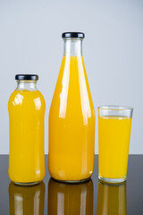 Bottle of orange juice and oranges