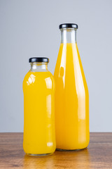 Bottle of orange juice and oranges