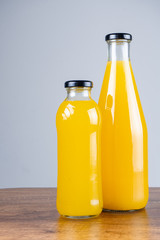 Bottle of orange juice and oranges