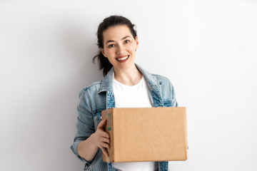 Happy woman with cardboard box.