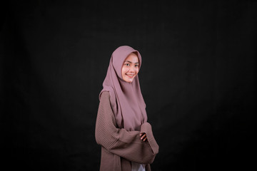 Portrait of Young Asian Islam woman wearing headscarf looking at camera and smiling happy expression