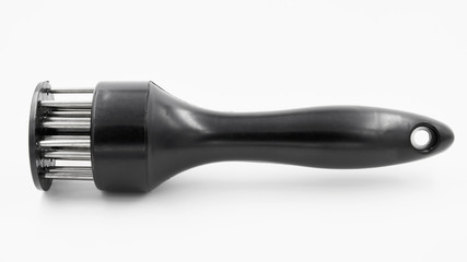 A hand-powered meat tenderizer for puncture the meat and cut into the fibers of the muscle on white background