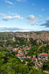 Fototapeta premium Panorama of Melnik, Bulgaria and sand pyramids from above. Beautiful landscape of the smallest bulgarian town, mountains at spring.