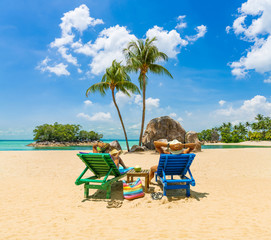 couple sitting and relaxing tropical the beach