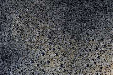 Background from coffee foam with bubbles.