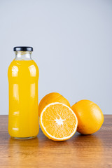 glass of orange juice and orange