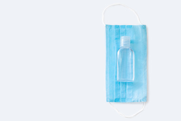 Medical face mask and hand sanitizer isolated