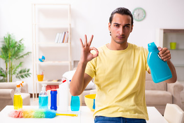 Young male contractor doing housework at home