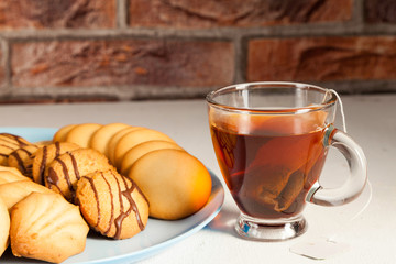 assorted tea pastes on a blue plate and tea cup