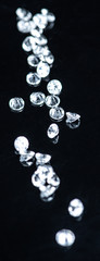 Small Diamonds on dark background (close up shot; selective focus)
