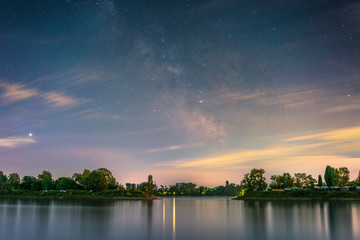The galactic center photographed from the shore of the river Rhine at Mannheim in Germany.