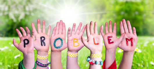 Children Hands Building Colorful English Word Problem. Sunny Green Grass Meadow As Background