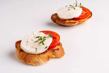 mozzarella with tomato slice on the toast