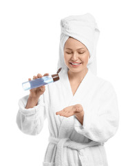 Beautiful young woman with shower gel on white background