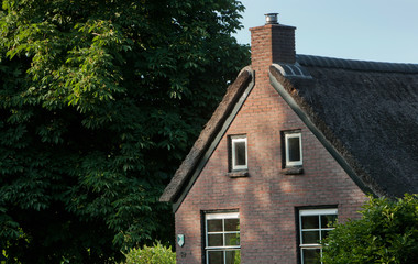 Fototapeta na wymiar Newly build colony house. Koloniehuisje. Maatschappij van Weldadigheid Frederiksoord Drenthe Netherlands. Panorama. Dirtroad. 