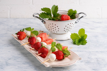 Strawberry with mozzarea on the stud