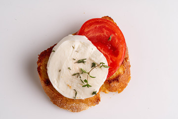 mozzarella with tomato slice on the toast