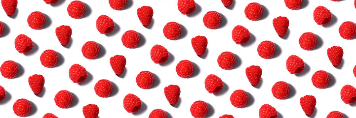 Banner made from pattern of fresh raspberry isolated on white.