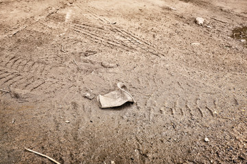Used plastic cup outdoors. Concept of soil pollution