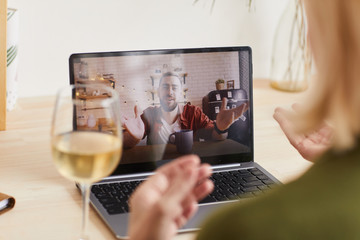 Happy son on laptop monitor talking to his mother online because of self isolation and quarantine