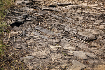 Builders' refuse outdoors. Concept of soil pollution