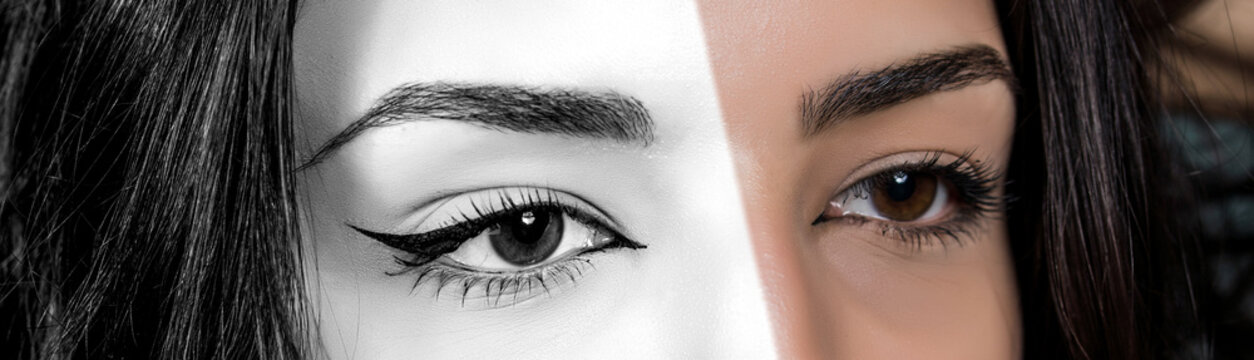 Close-up photo of woman eye with eyeliner makeup. Colorful, black and white. Creative concept.