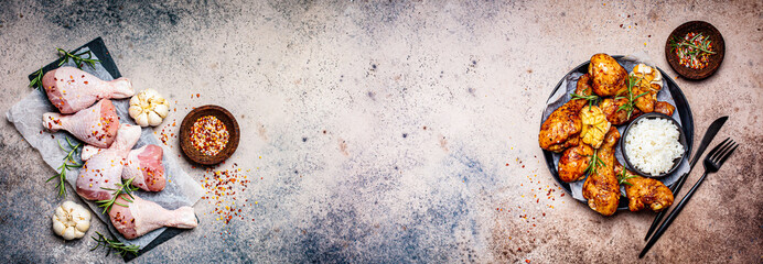 Chicken meat banner. Raw chicken legs and baked spicy chicken legs. Dark background, copy space.