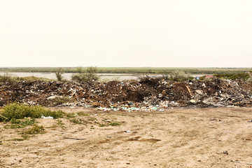 View of landfill outdoors. Concept of soil pollution