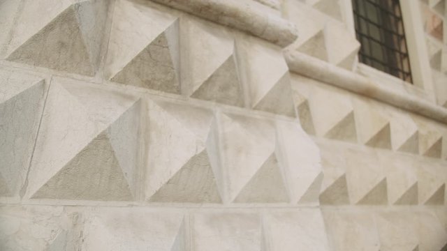Close up tilt up on Palazzo dei Diamanti in Ferrara, Italy