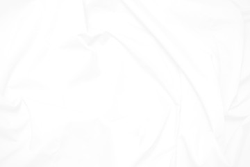 White  fabric cloth background abstract with soft waves , flowing draped cloth in rippled elegant curves and wrinkled creases , soft focus, textured background and abstract
